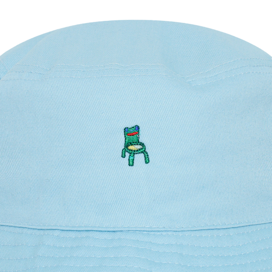Photograph of a blue bucket hat with an embroidered froggy chair design