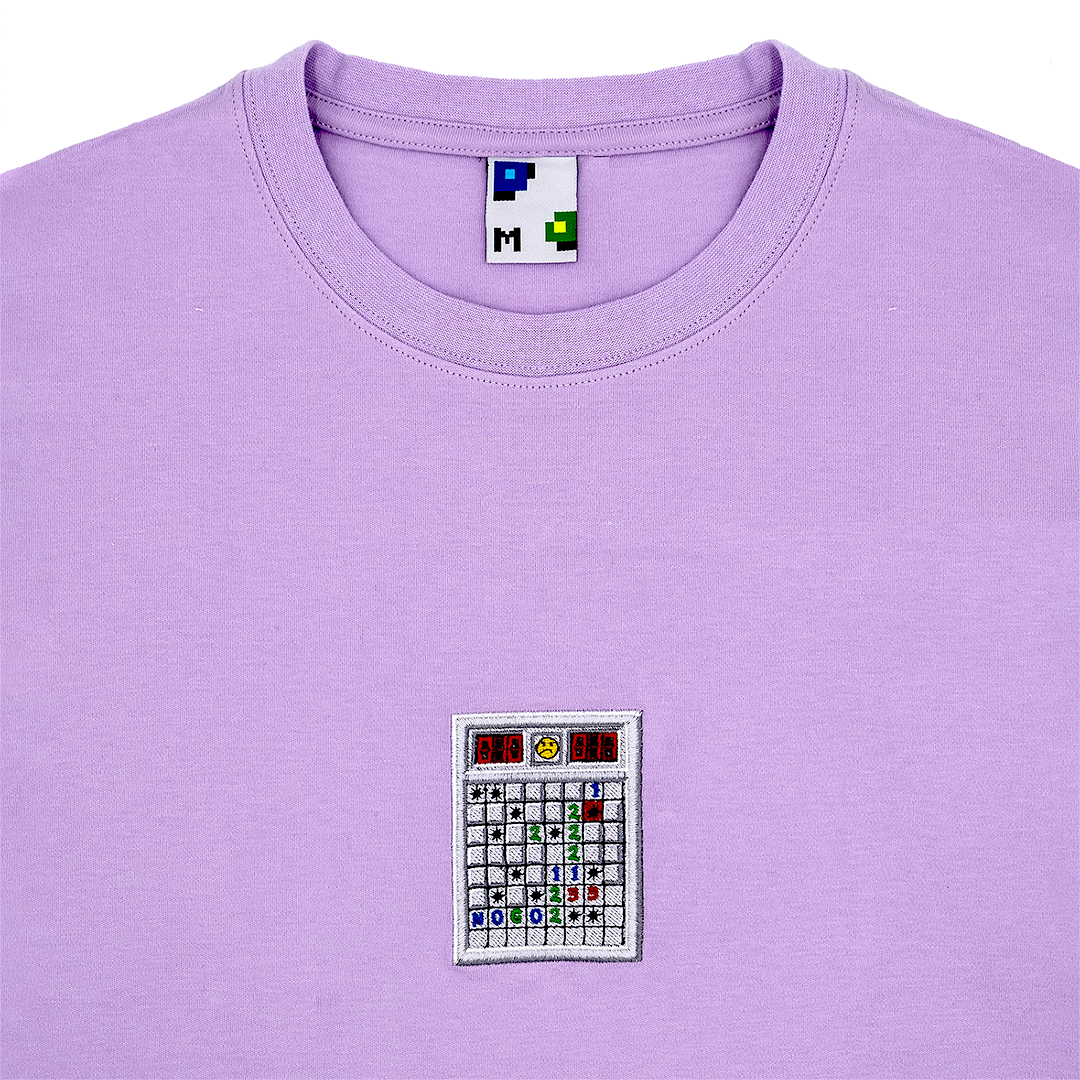 Photograph of purple tshirt with minesweeper embroidery design