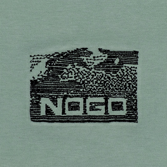 Close-up photograph of embroidery design that reads nogo