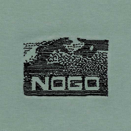 Close-up photograph of embroidery design that reads nogo