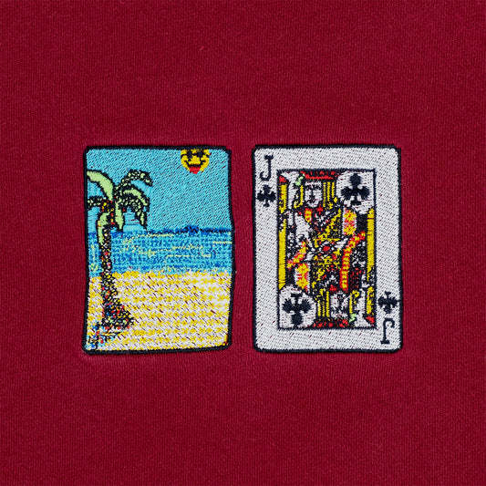 Close-up photograph of solitaire card embroidery