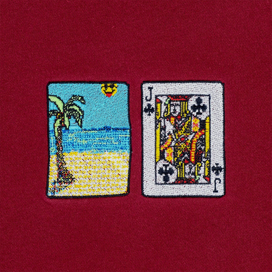 Close-up photograph of solitaire card embroidery