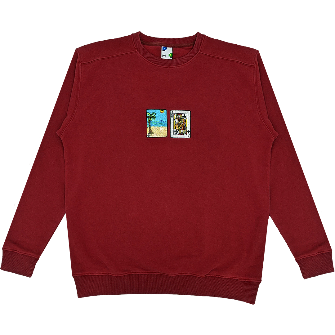 Photograph of red crewneck with solitaire card embroidery