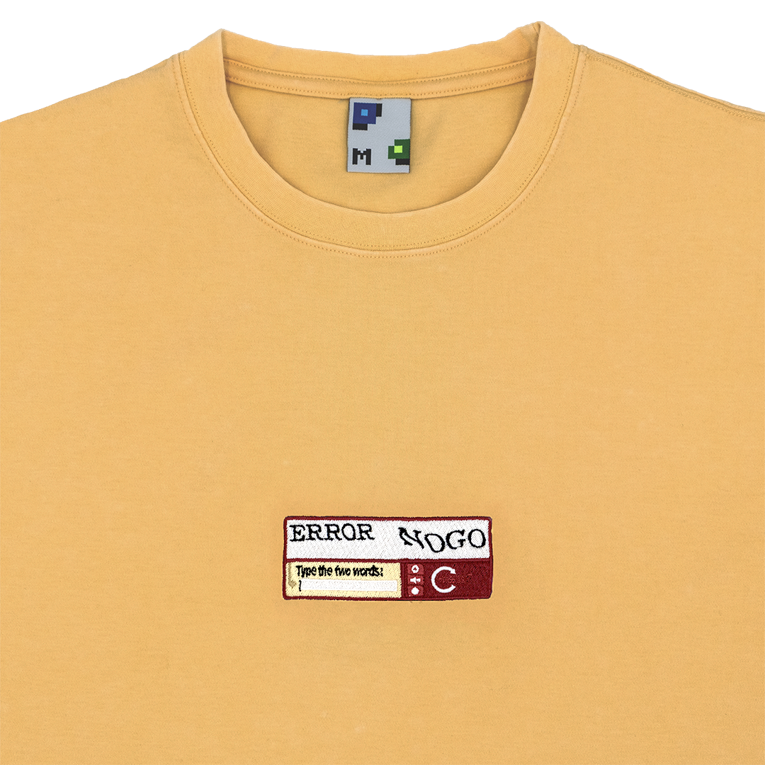 Collar-shot photograph of yellow tshirt with captcha embroidery design