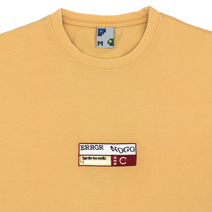 Collar-shot photograph of yellow tshirt with captcha embroidery design