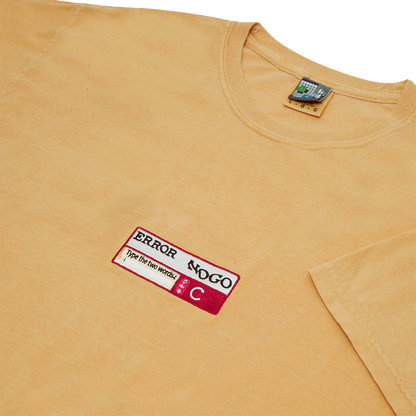 Side-angle photograph of yellow tshirt with captcha embroidery design