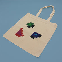 Load image into Gallery viewer, Photograph of cotton tote bag with error symbols on
