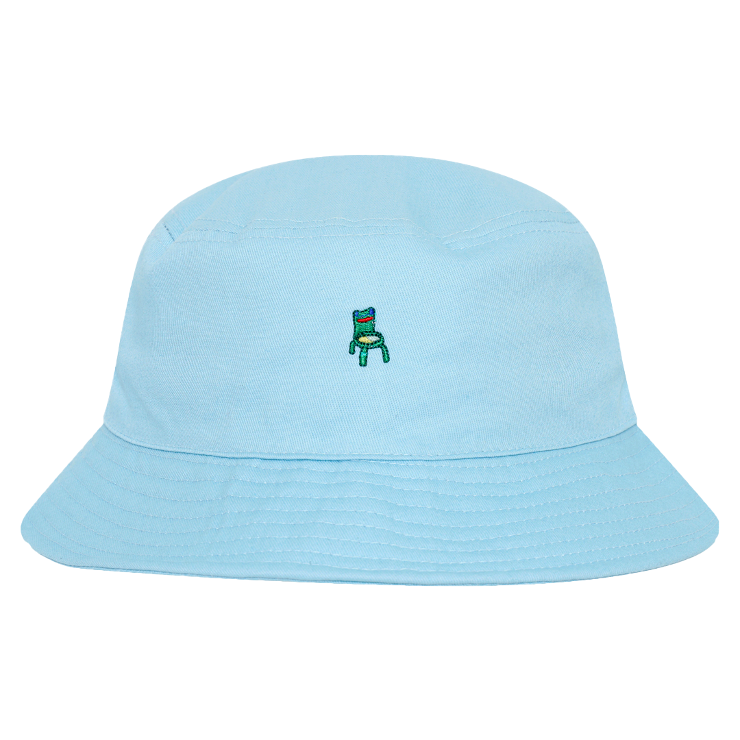 Photograph of a blue bucket hat with an embroidered froggy chair design