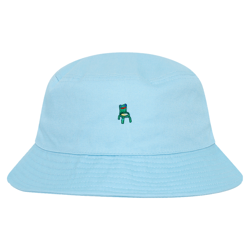 Photograph of a blue bucket hat with an embroidered froggy chair design