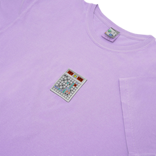 Load image into Gallery viewer, Side-angle photograph of purple tshirt with minesweeper embroidery design
