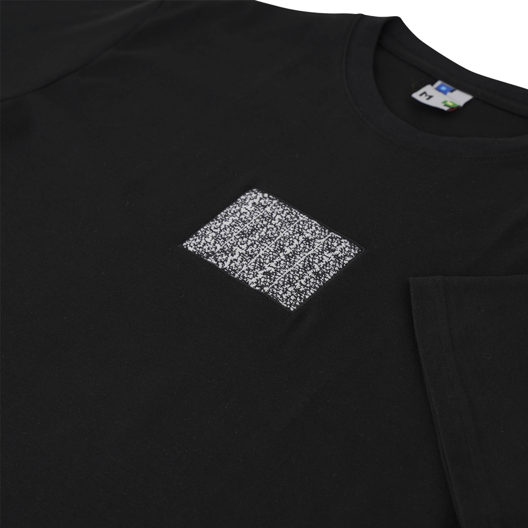 Side-angle photograph of black tshirt with static embroidery in 4:3 ratio