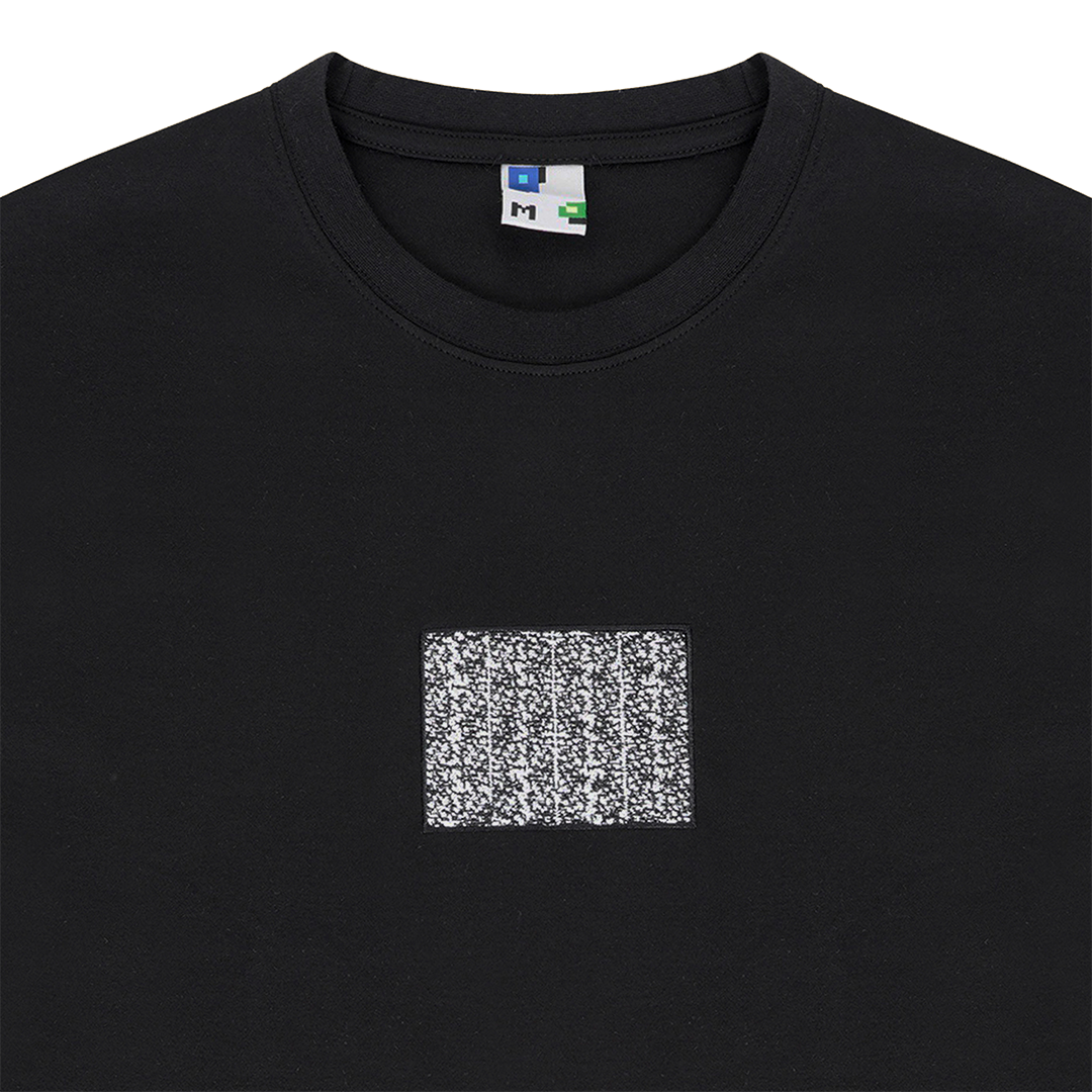 Collar shot photograph of black tshirt with static embroidery in 4:3 ratio