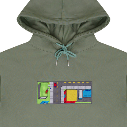 Collar shot photograph of green hoodie with embroidery design