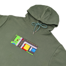 Load image into Gallery viewer, Side-angle photograph of green hoodie with embroidery design
